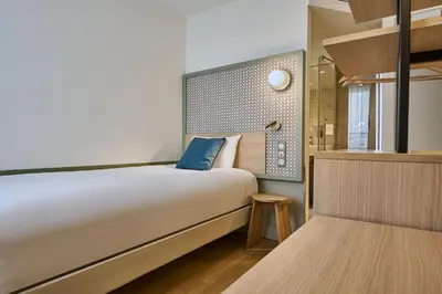 Un ou plusieurs lits dans un hébergement de l'établissement Hotel Cervantes by Happyculture