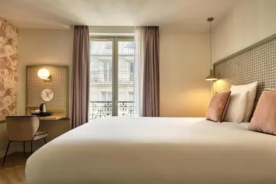 Un ou plusieurs lits dans un hébergement de l'établissement Hotel Cervantes by Happyculture