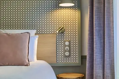 Un ou plusieurs lits dans un hébergement de l'établissement Hotel Cervantes by Happyculture