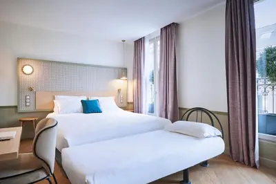 Un ou plusieurs lits dans un hébergement de l'établissement Hotel Cervantes by Happyculture