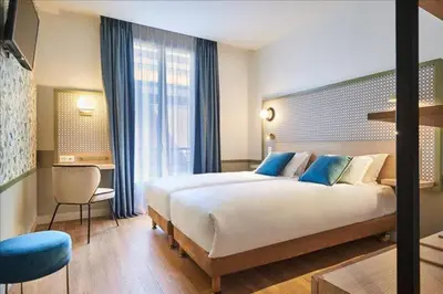 Un ou plusieurs lits dans un hébergement de l'établissement Hotel Cervantes by Happyculture