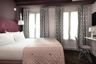Un ou plusieurs lits dans un hébergement de l'établissement Hôtel Marais Hôme