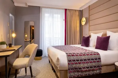 Un ou plusieurs lits dans un hébergement de l'établissement Hôtel Nude Paris - Color Vision