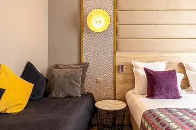 Un ou plusieurs lits dans un hébergement de l'établissement Hôtel Nude Paris - Color Vision