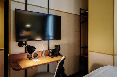 Télévision ou salle de divertissement dans l'établissement Hôtel Riesner