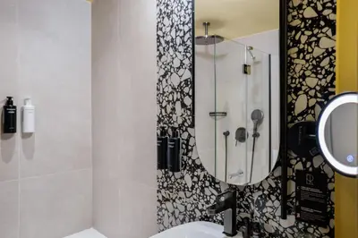 Salle de bains dans l'établissement Hôtel Riesner