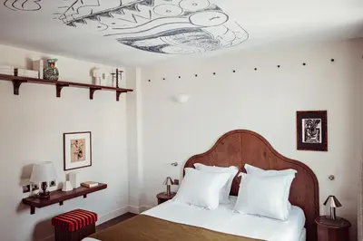 Un ou plusieurs lits dans un hébergement de l'établissement Hotel des Académies et des Arts