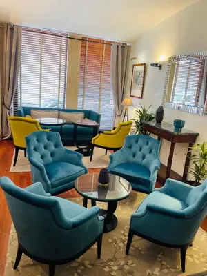 Coin salon dans l'établissement Hôtel Delavigne