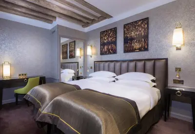Un ou plusieurs lits dans un hébergement de l'établissement Vendôme Opera Hotel