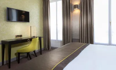 Un ou plusieurs lits dans un hébergement de l'établissement Vendôme Opera Hotel
