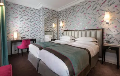 Un ou plusieurs lits dans un hébergement de l'établissement Vendôme Opera Hotel