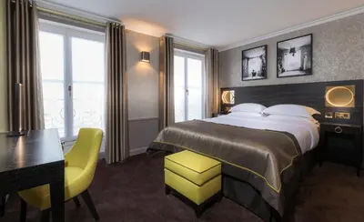 Un ou plusieurs lits dans un hébergement de l'établissement Vendôme Opera Hotel