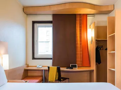 Un ou plusieurs lits dans un hébergement de l'établissement ibis Paris Pont de Suresnes Longchamp