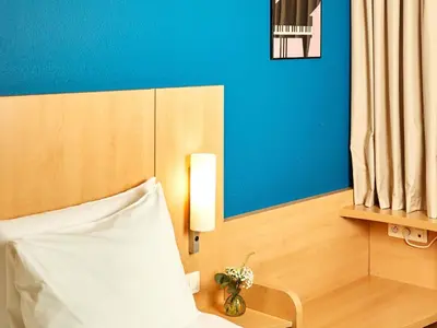 Un ou plusieurs lits dans un hébergement de l'établissement ibis Paris la Défense Esplanade