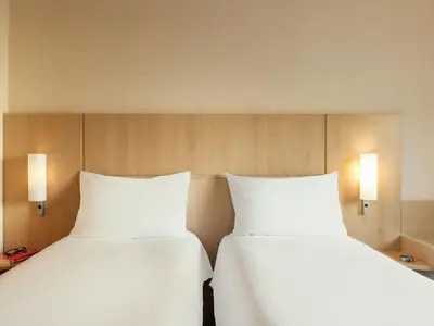 Un ou plusieurs lits dans un hébergement de l'établissement ibis Paris la Défense Esplanade