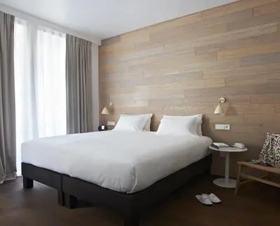 Un ou plusieurs lits dans un hébergement de l'établissement 9Hotel Opera