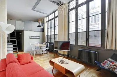 Coin salon dans l'établissement Pick A Flat's Apartment in Upper Marais - Rue d'Hauteville