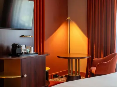 Un ou plusieurs lits dans un hébergement de l'établissement Nest Hotel Paris la Défense - MGallery Collection