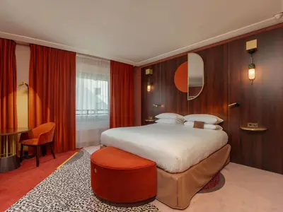 Un ou plusieurs lits dans un hébergement de l'établissement Nest Hotel Paris la Défense - MGallery Collection