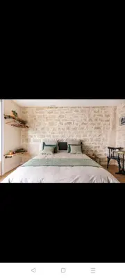 Un ou plusieurs lits dans un hébergement de l'établissement IMHOST - Amazing architect studio Père Lachaise