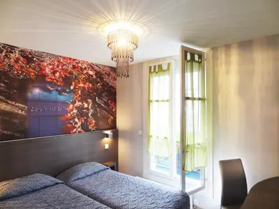 Coin salon dans l'établissement Amélie Hotel