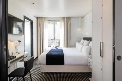 Un ou plusieurs lits dans un hébergement de l'établissement Hôtel Félicien & Spa