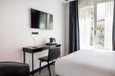Un ou plusieurs lits dans un hébergement de l'établissement Hôtel Félicien & Spa