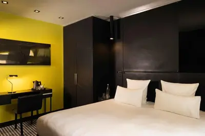 Un ou plusieurs lits dans un hébergement de l'établissement Hôtel Félicien & Spa