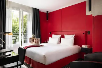 Un ou plusieurs lits dans un hébergement de l'établissement Hôtel Félicien & Spa