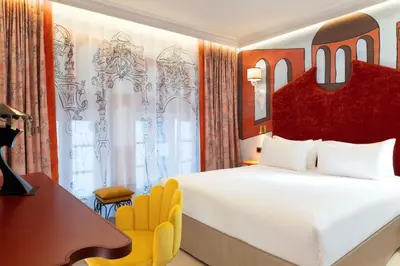 Un ou plusieurs lits dans un hébergement de l'établissement Hôtel Le Magnifique Ex Hôtel Le M