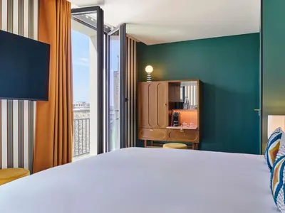 Un ou plusieurs lits dans un hébergement de l'établissement Mercure Paris Butte Montmartre Basilique
