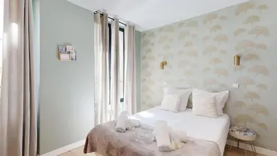 Un ou plusieurs lits dans un hébergement de l'établissement 126 Suite Abraham - Superbe Appartement à Paris