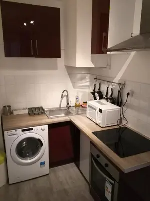 Cuisine ou kitchenette dans l'établissement Modern apartment and studio near the metro