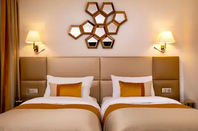 Un ou plusieurs lits dans un hébergement de l'établissement Hotel De Suede Saint Germain