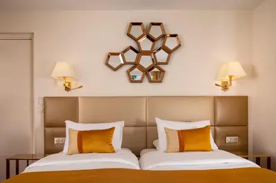 Un ou plusieurs lits dans un hébergement de l'établissement Hotel De Suede Saint Germain