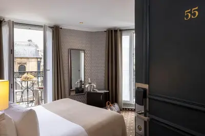 Un ou plusieurs lits dans un hébergement de l'établissement Hotel Abbatial Saint Germain