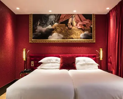 Un ou plusieurs lits dans un hébergement de l'établissement Hotel Eiffel Petit Louvre