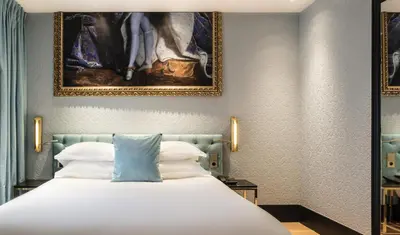 Un ou plusieurs lits dans un hébergement de l'établissement Hotel Eiffel Petit Louvre