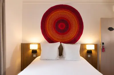 Un ou plusieurs lits dans un hébergement de l'établissement Hôtel Korner Etoile