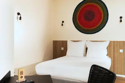 Un ou plusieurs lits dans un hébergement de l'établissement Hôtel Korner Etoile