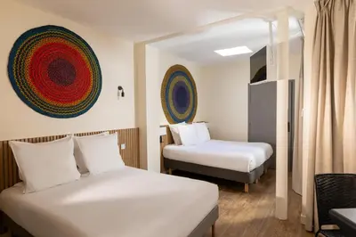 Un ou plusieurs lits dans un hébergement de l'établissement Hôtel Korner Etoile