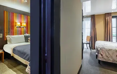 Un ou plusieurs lits dans un hébergement de l'établissement Hôtel Du Vieux Saule