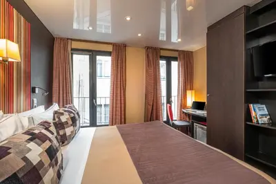 Un ou plusieurs lits dans un hébergement de l'établissement Hôtel Du Vieux Saule