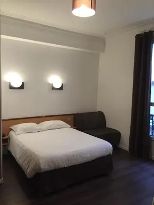 Un ou plusieurs lits dans un hébergement de l'établissement Hôtel Liège Strasbourg