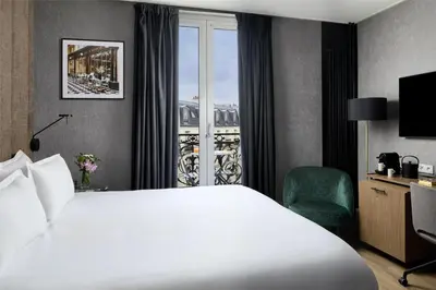 Un ou plusieurs lits dans un hébergement de l'établissement NH Paris Opéra Faubourg