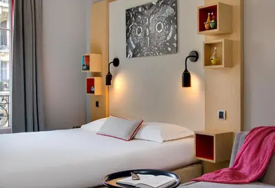 Un ou plusieurs lits dans un hébergement de l'établissement Chouette Hotel