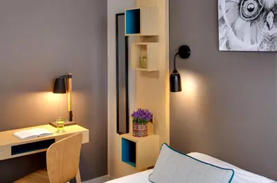 Un ou plusieurs lits dans un hébergement de l'établissement Chouette Hotel