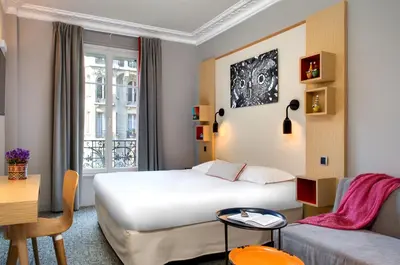 Un ou plusieurs lits dans un hébergement de l'établissement Chouette Hotel