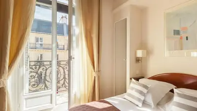 Un ou plusieurs lits dans un hébergement de l'établissement Excelsior Opera
