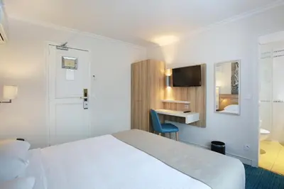Un ou plusieurs lits dans un hébergement de l'établissement Hotel Lautrec Opera